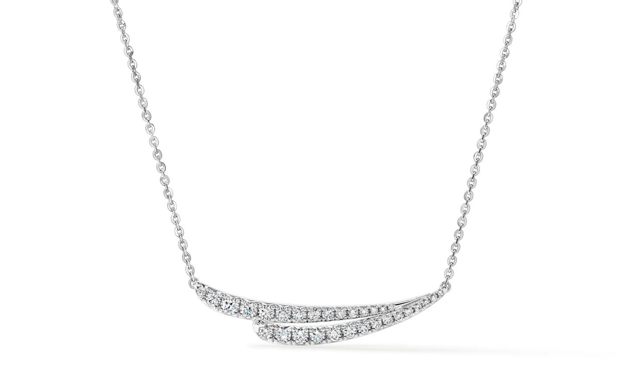 A glowing white gold double-arc diamond necklace, radiating brilliant luster. 