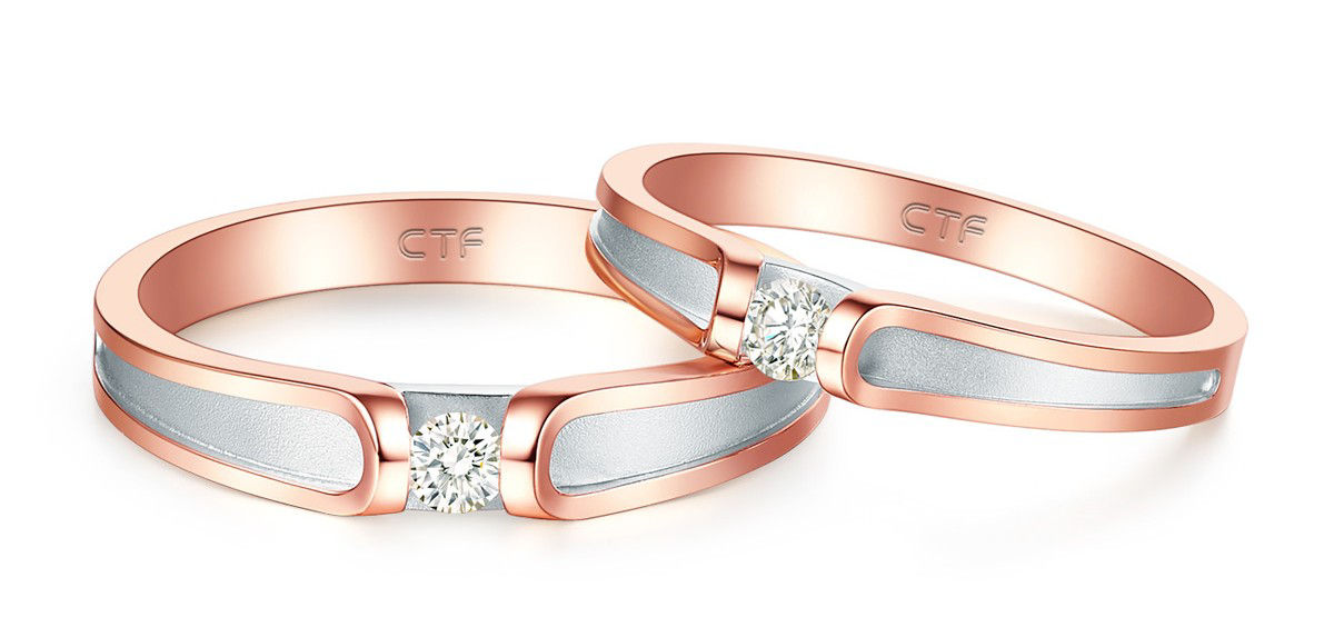 The wedding bands combine rose gold and platinum with diamonds symbolizing happiness and eternity.