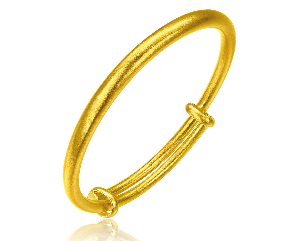 Minimalist fine gold baby Bangle with a smooth and rounded design, representing completeness and happiness.