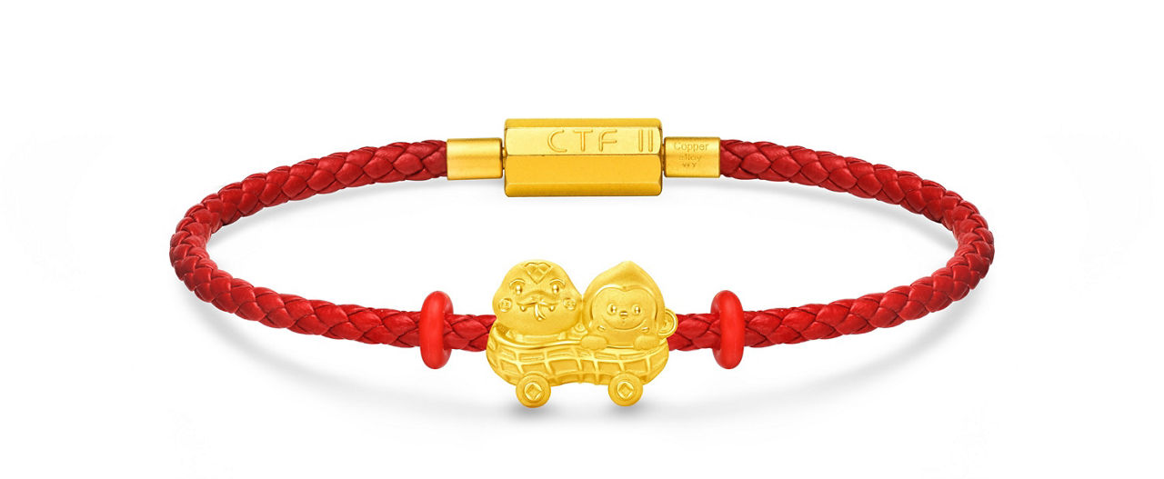 Peanut-shaped gold zodiac charm with a red string bracelet, symbolizing auspiciousness and good fortune.