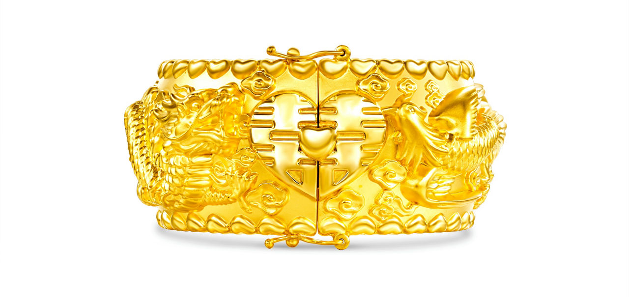 Pure gold bracelet with dragon and phoenix pattern in relief, symbolizing auspiciousness. The double happiness character signifies happiness is coming.