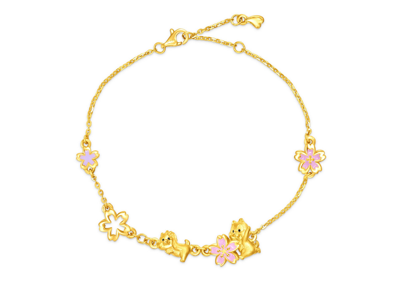 The Chip and Dale Pure Gold Necklace is accented with romantic pink cherry blossoms, adding warmth and charm.