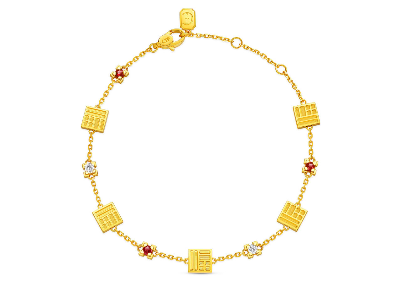 「福」字金磚交織鑽石與紅寶石，象徵福澤連綿，守護健康平安。