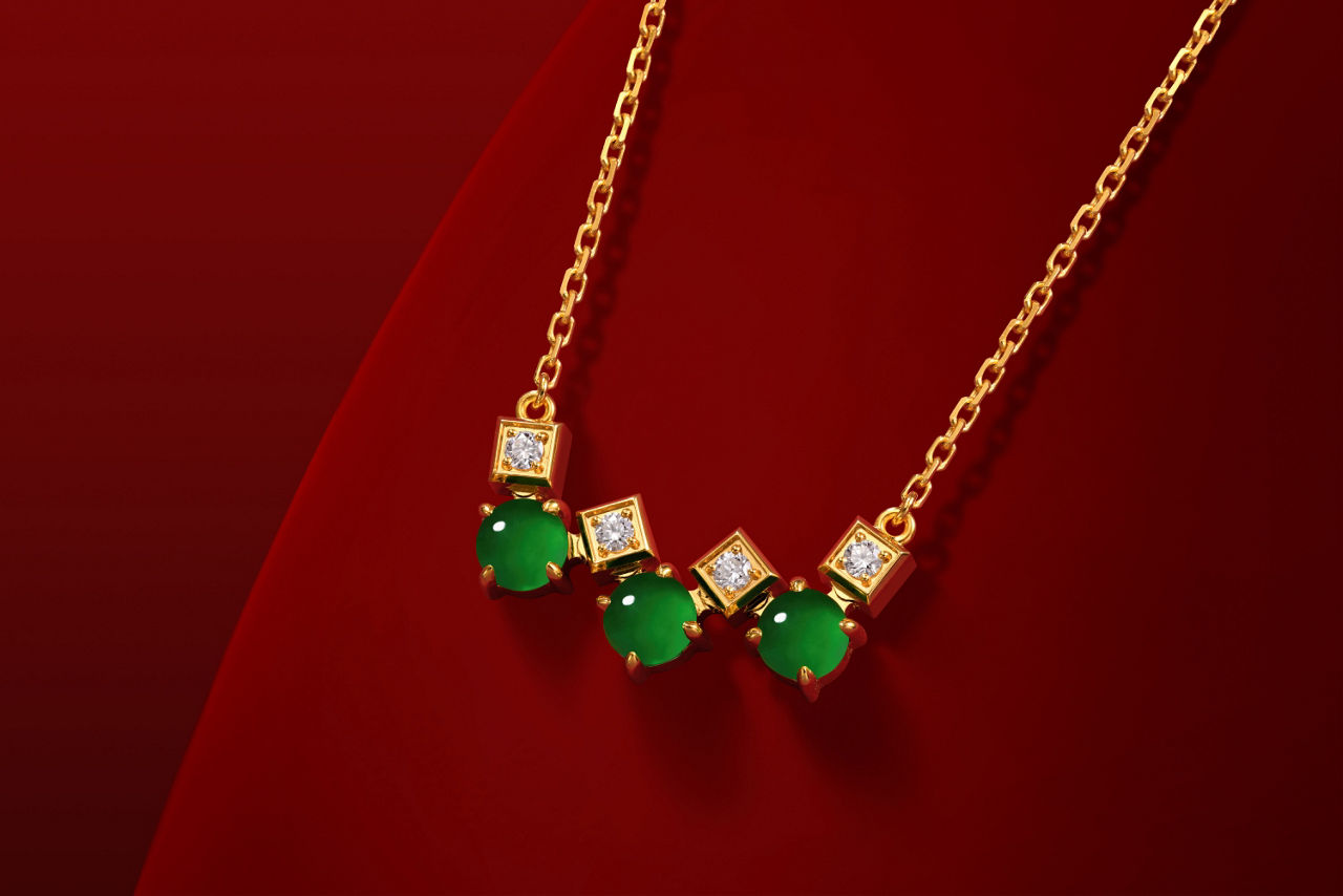 Natural green jadeite and sparkling diamonds set in gold, showcasing a translucent, lustrous finish. 