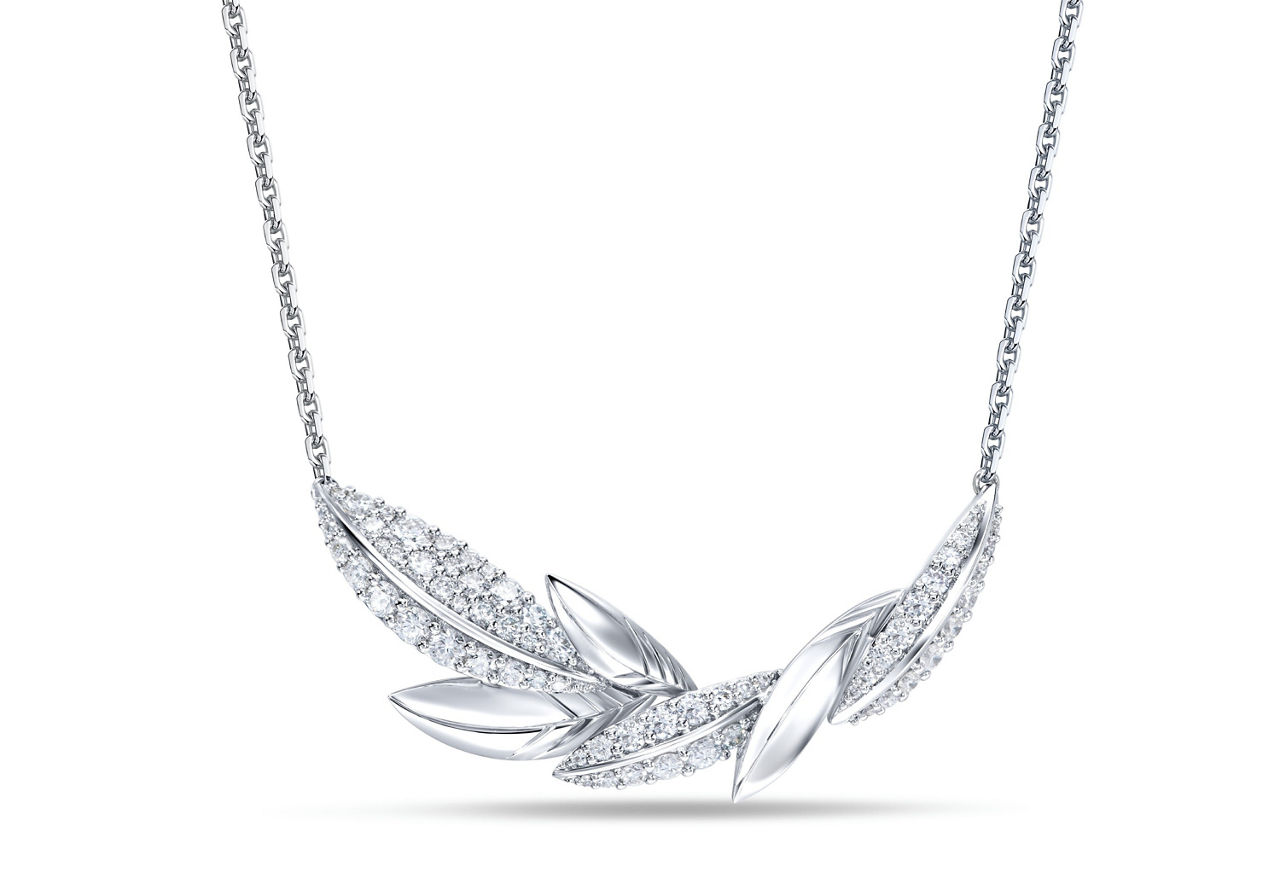 The natural diamond necklace with delicate diamond settings highlights the bride's radiant charm.